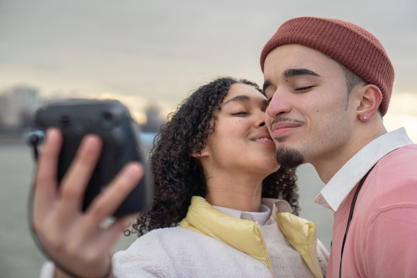 Couple taking a selfie by the river