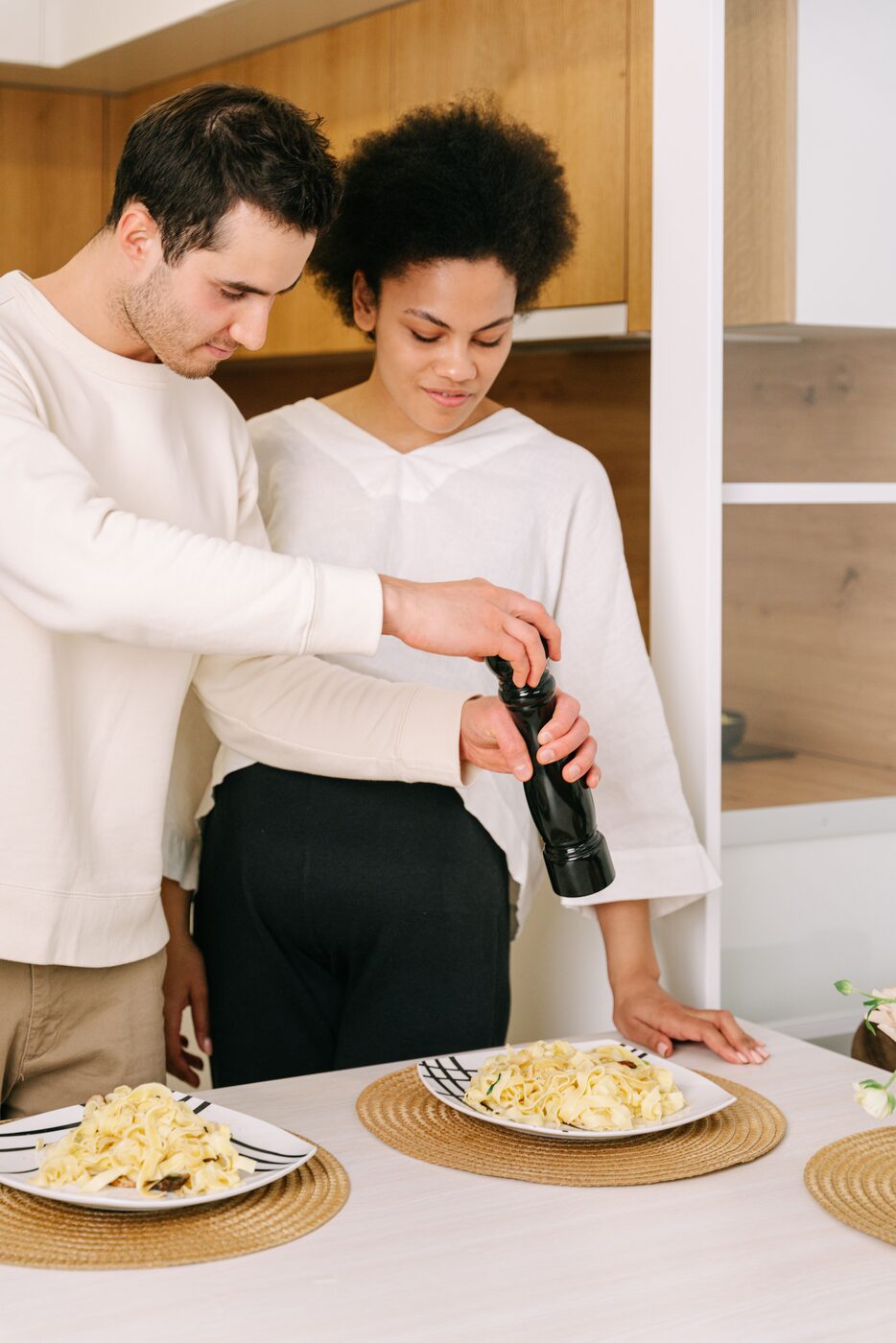 Couple cooking dinner together