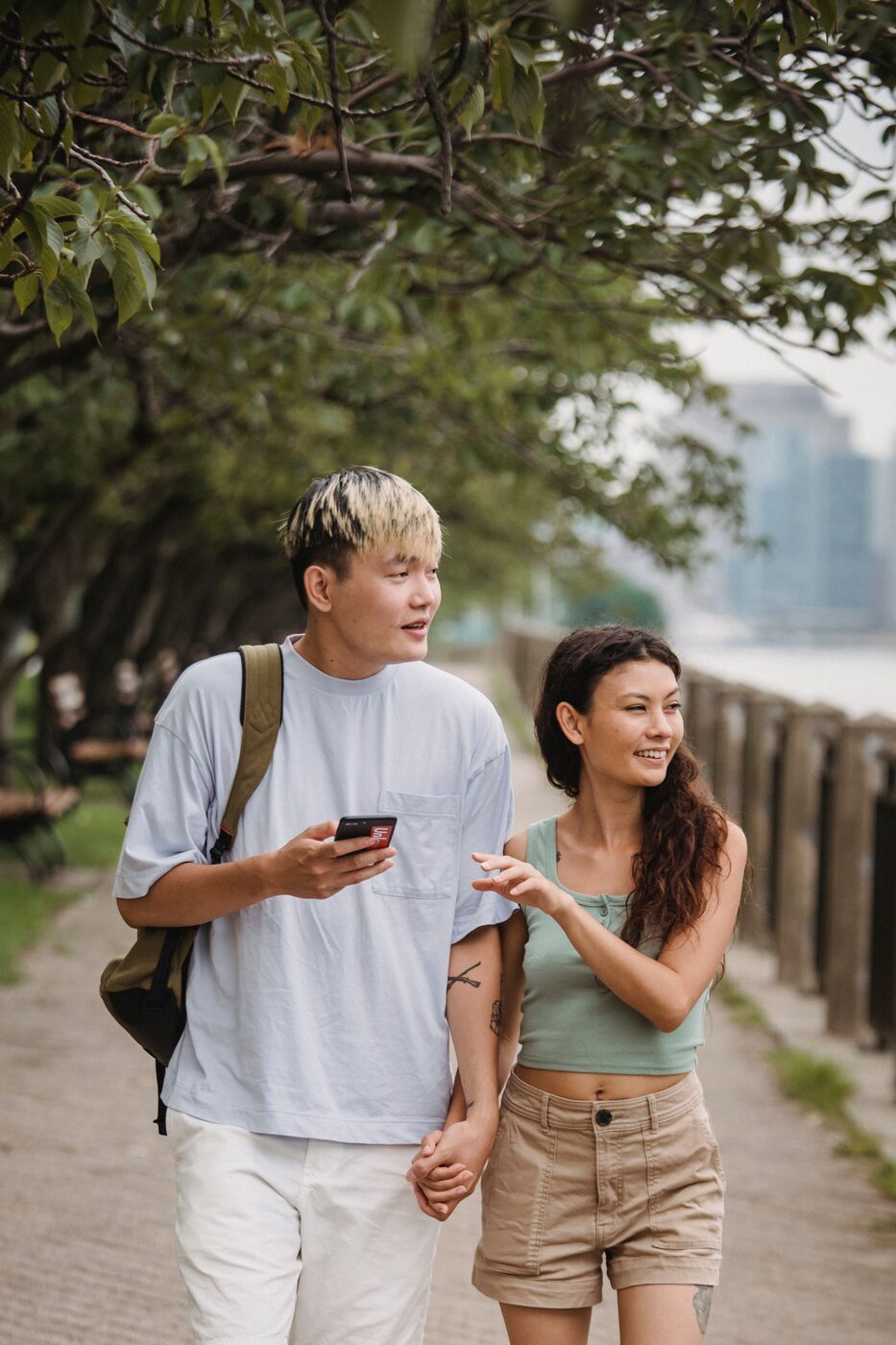 Couple walking along the waterfront